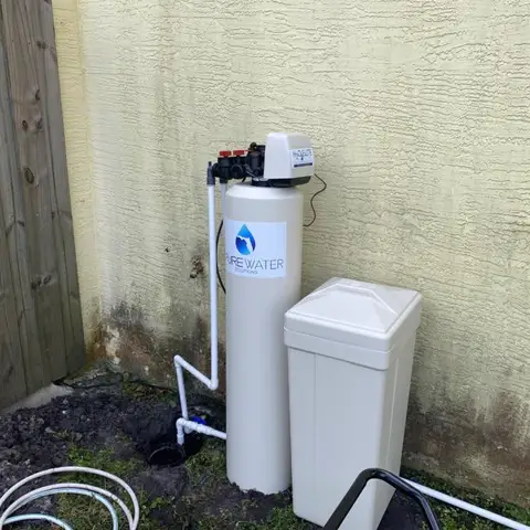 Whole-home water softener installed outside a Central Florida home